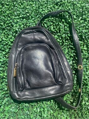 Vintage Tignanello black leather sling back w/ gold toned grommets & utilities